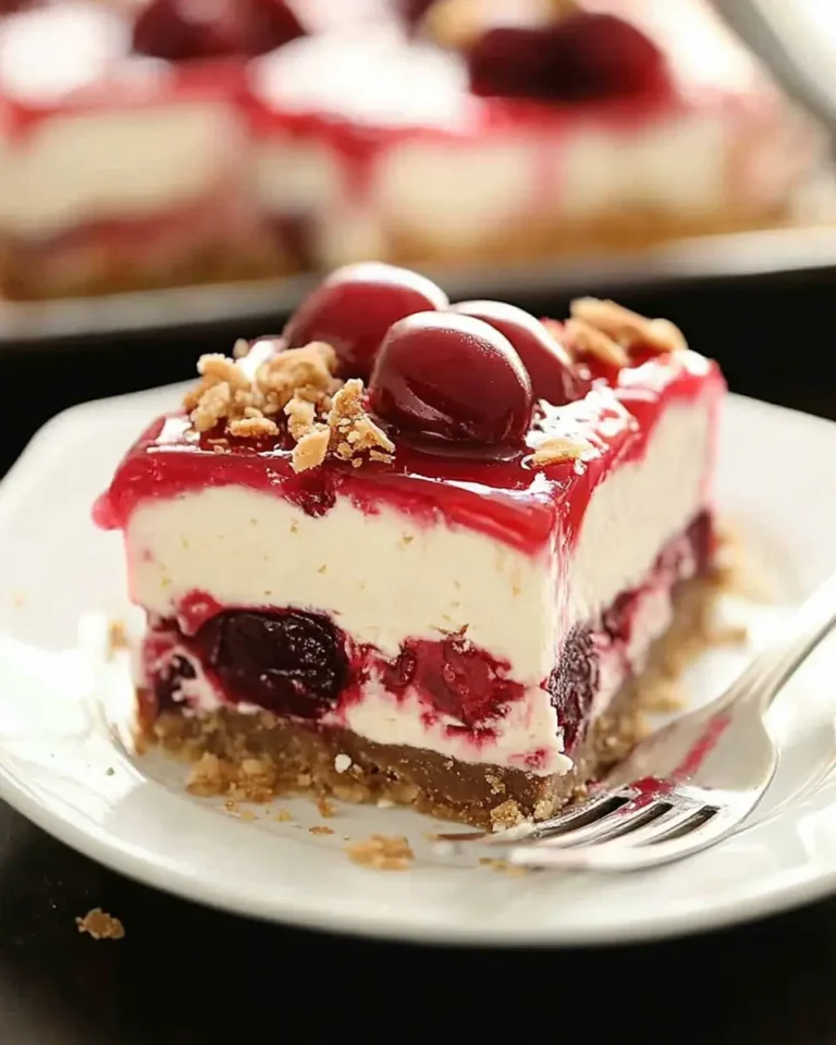 A delicious plate of Layered Cherry Cheesecake Lush Dessert Recipe